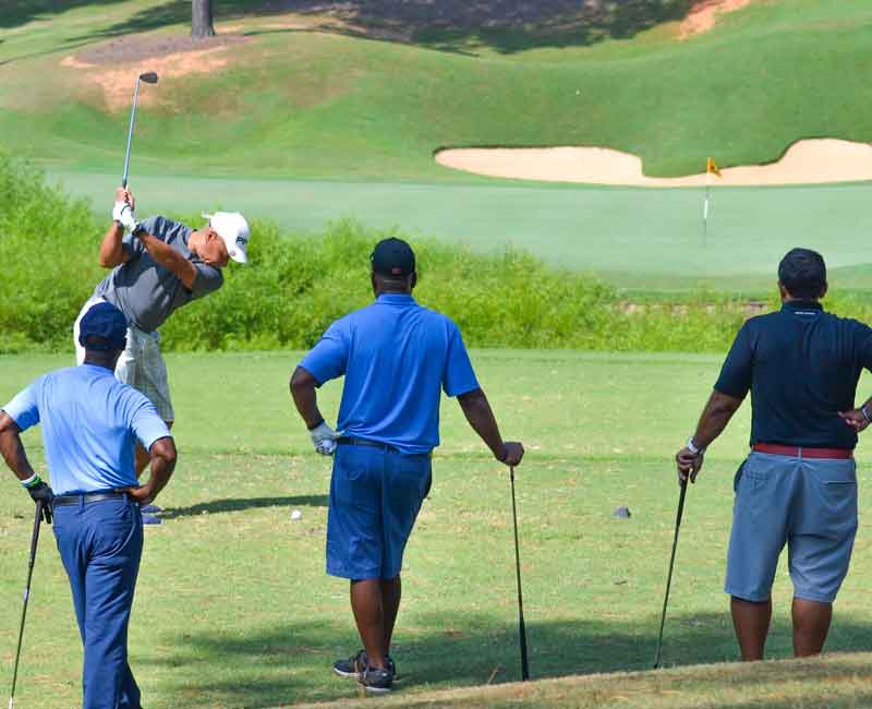Golfers playing at a RFHF golf event