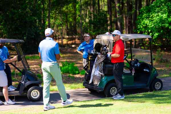 2026 Fairways to Freedom Golf Tournament - golfers interacting on golf course
