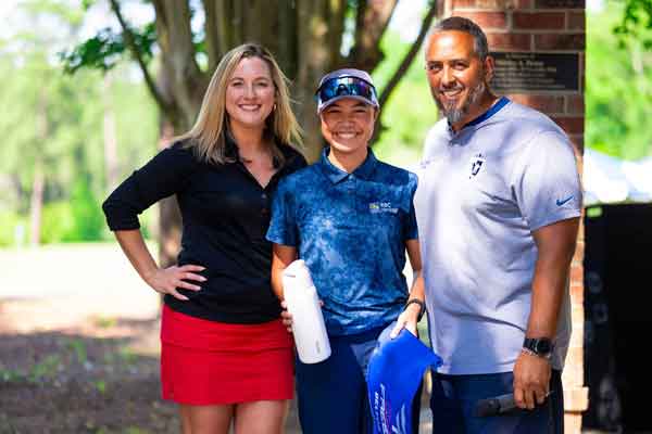 2026 Fairways to Freedom Golf Tournament - golfers taking a photo with founder of Range Fore Hope
